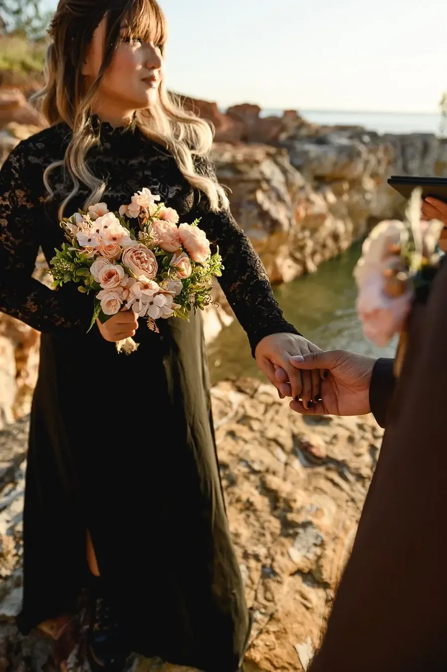 Couple getting married on the Darwin clifftops at sunset with I Do Drive Thru — elopement celebrant from $400
