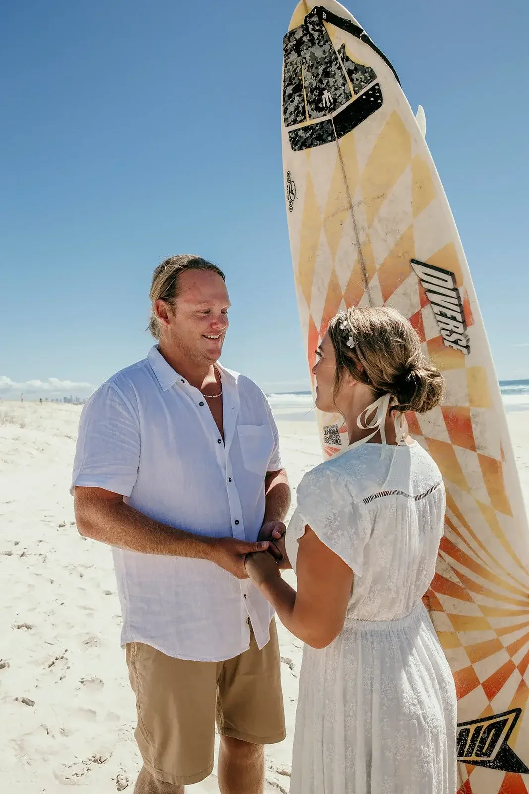 Couple eloping in front of the waterway on the Gold Coast with I Do Drive Thru — elopement celebrant from $400