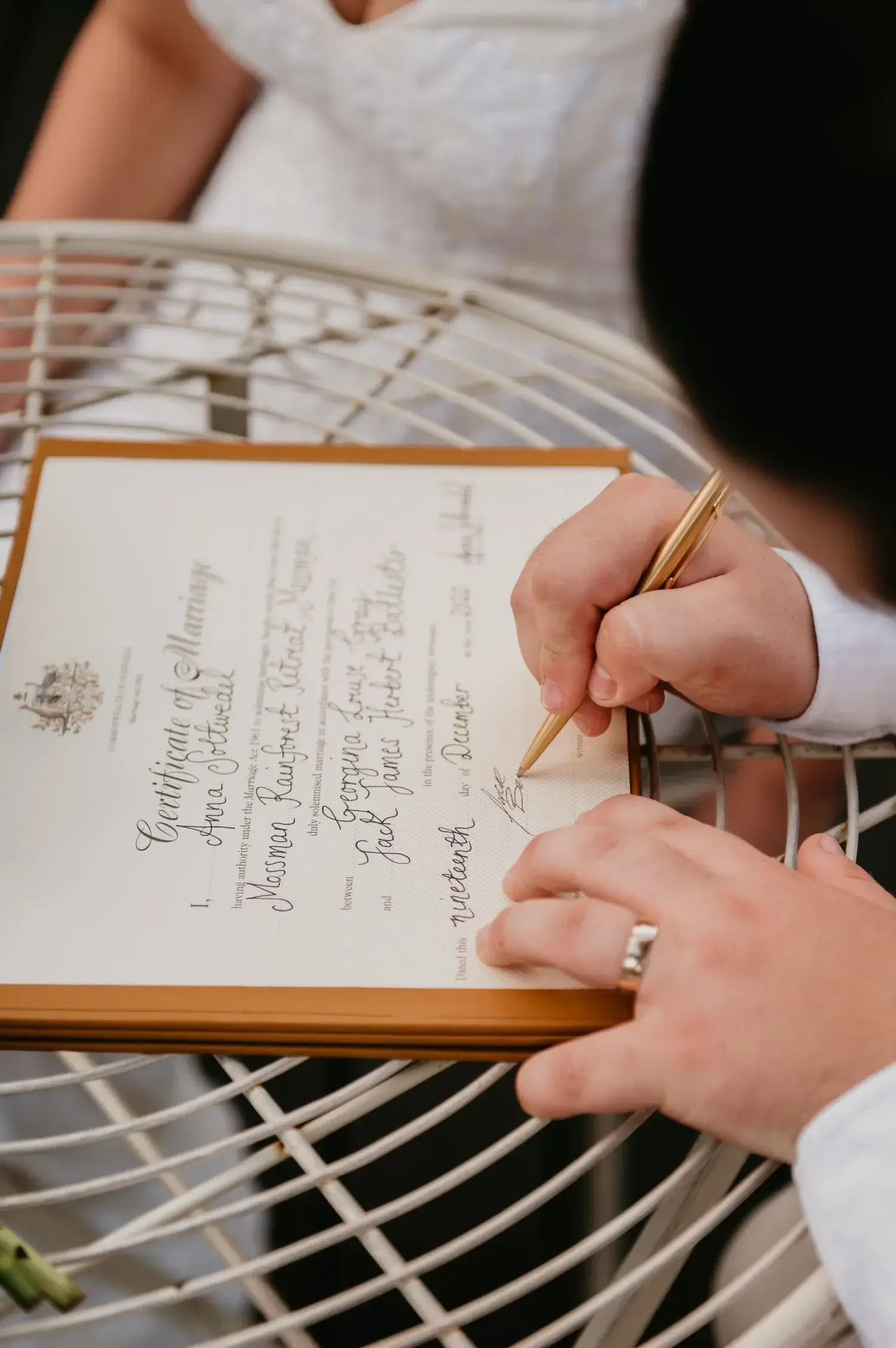 Marriage certificate being signed at an elopement in Australia with I Do Drive Thru — paperwork