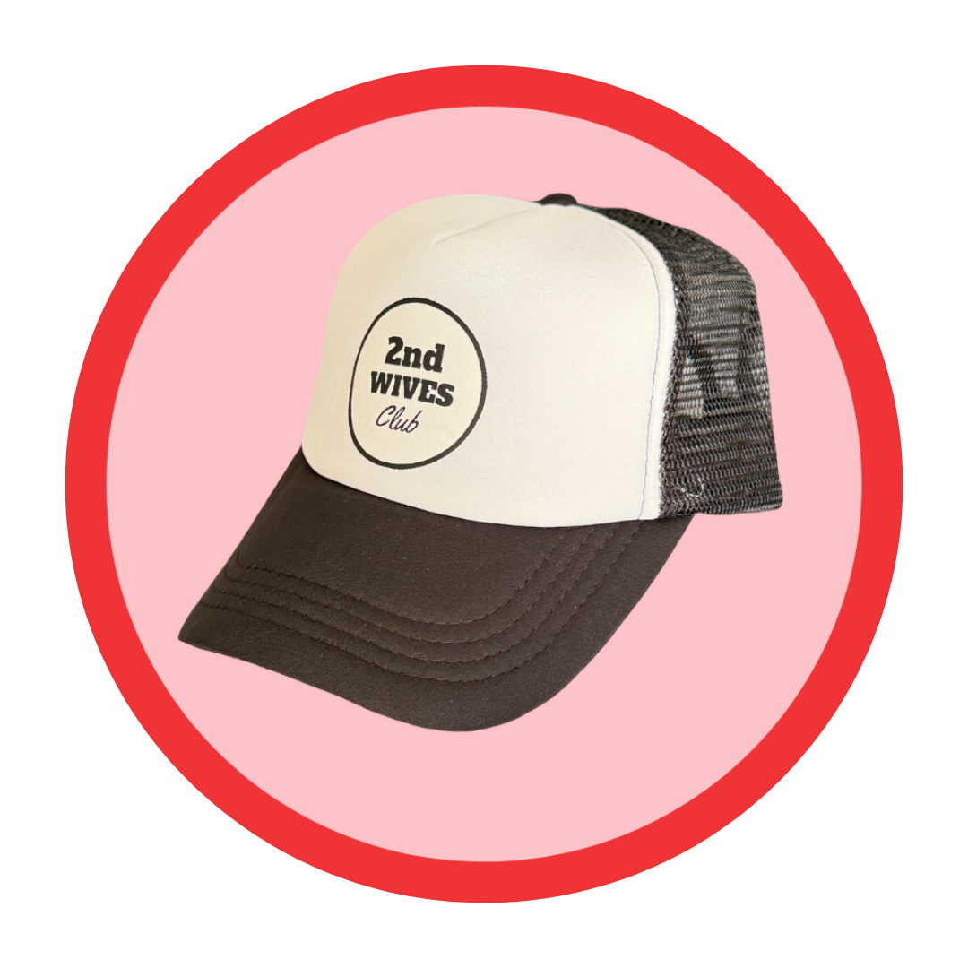 The 2nd Wives Club Hat - this black-and-white cap is bold, tongue-in-cheek, and unapologetically iconic.