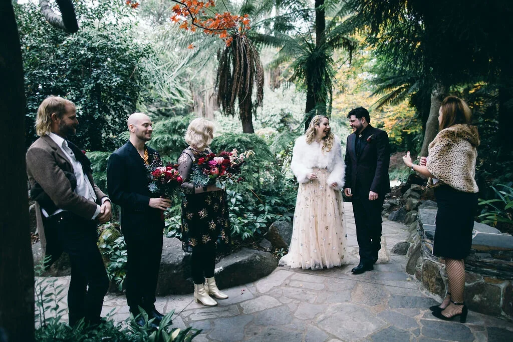 Couple having a small wedding ceremony at Alfred Nicholas Gardens Olinda in the Dandenong Ranges with I Do Drive Thru — park elopement from $400