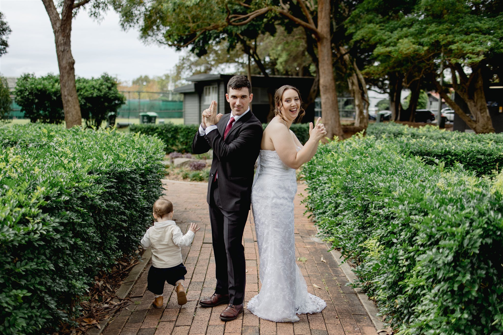 Couple just married at Centennial Park Newcastle with their toddler son with I Do Drive Thru — family elopement from $400