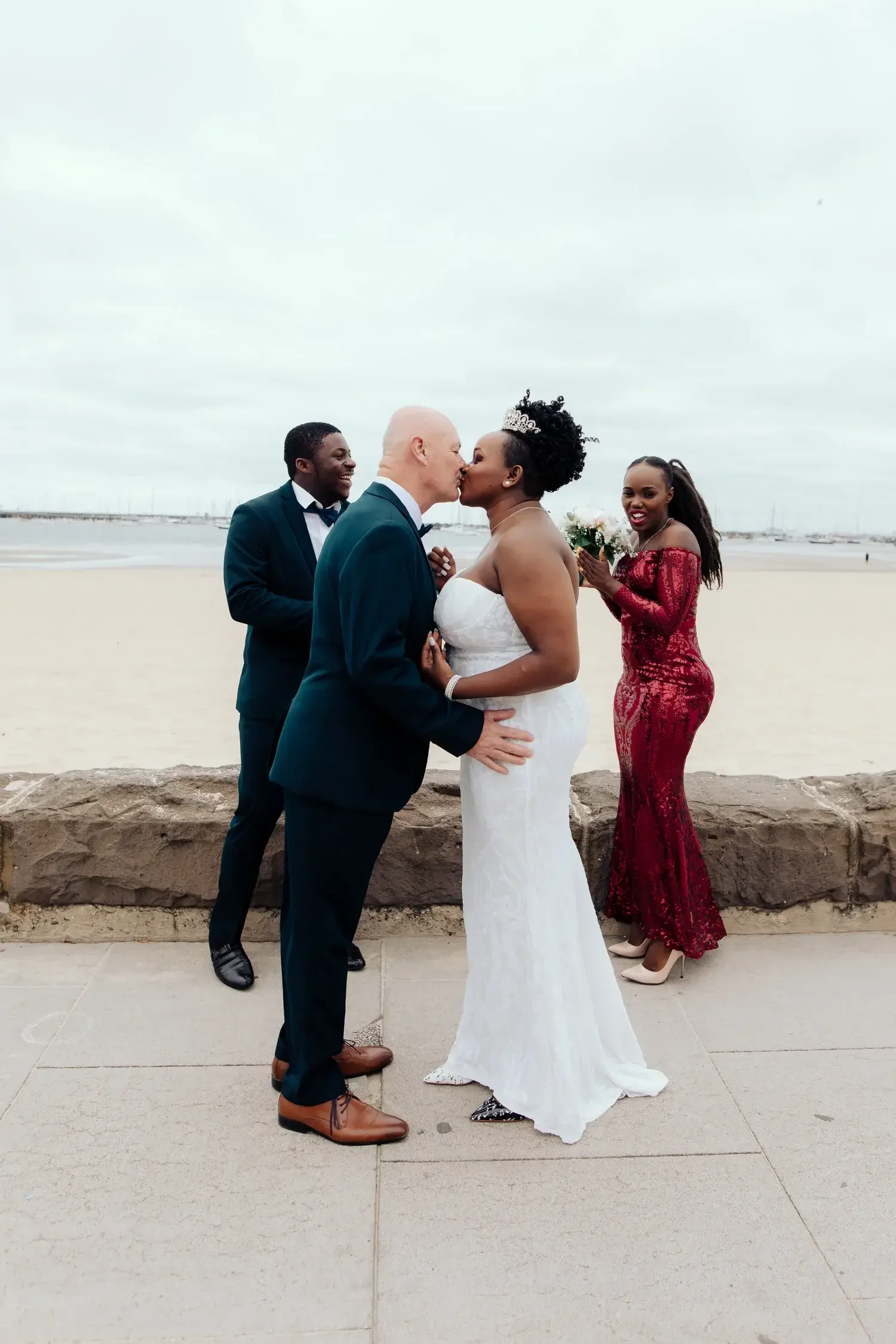 couple-eloping-kids-surfboard-gold-coast-beach-i-do-drive-thru