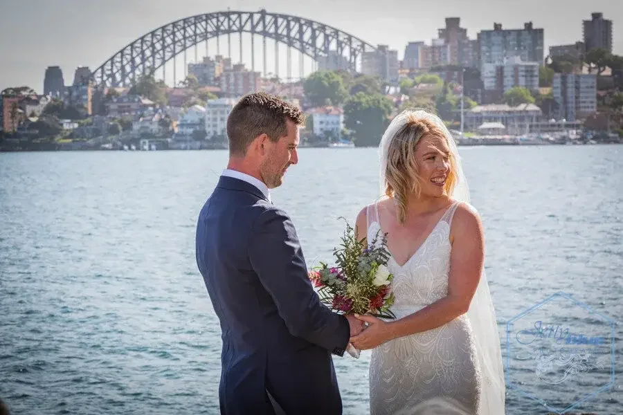 Couple getting married on the Sydney Harbour waterfront with I Do Drive Thru — elopement celebrant from $400