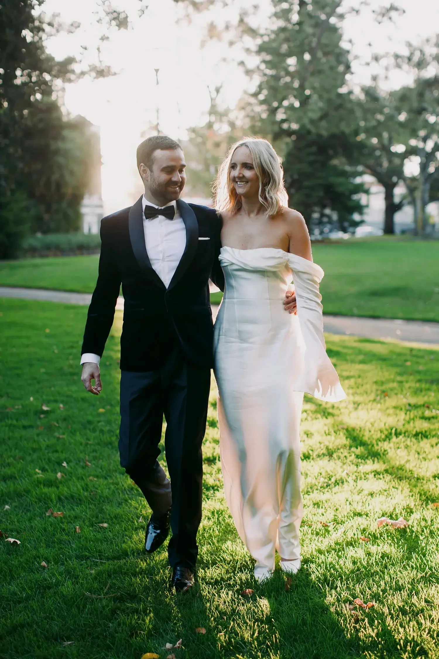 Couple walking into their micro wedding ceremony at Carlton Gardens Melbourne with I Do Drive Thru — Fancy Pants Package from $600