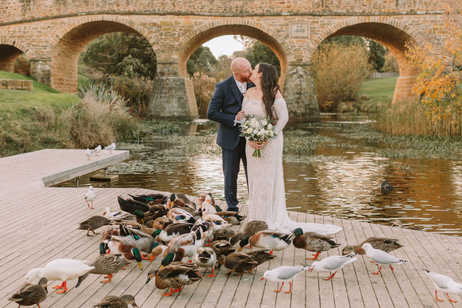Couple eloping in Tasmanian mountains with celebrant and photographer