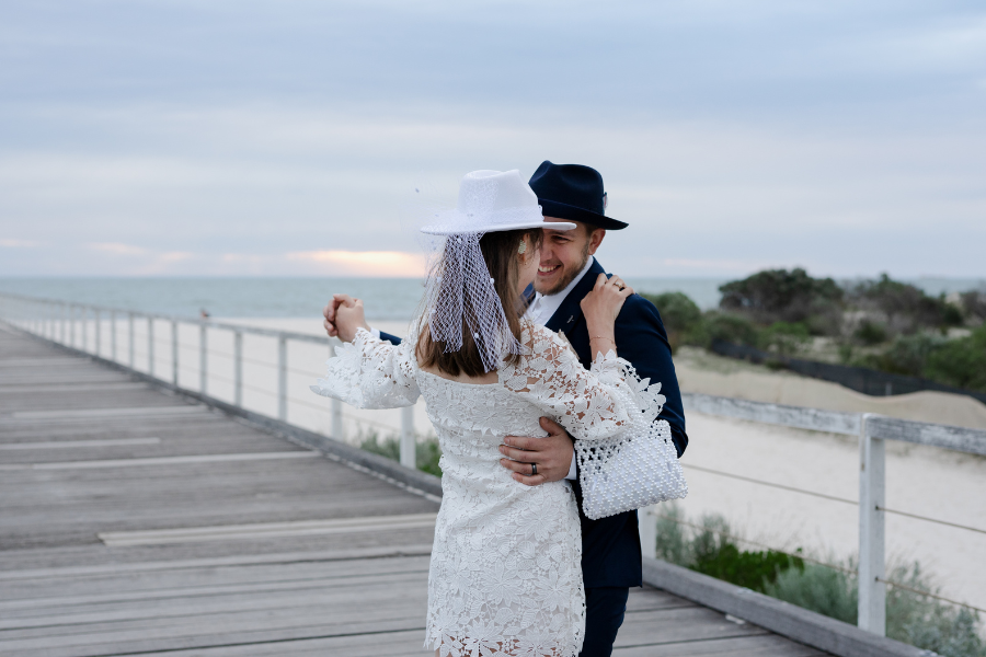 2026 elopement couple embracing with scenic backdrop