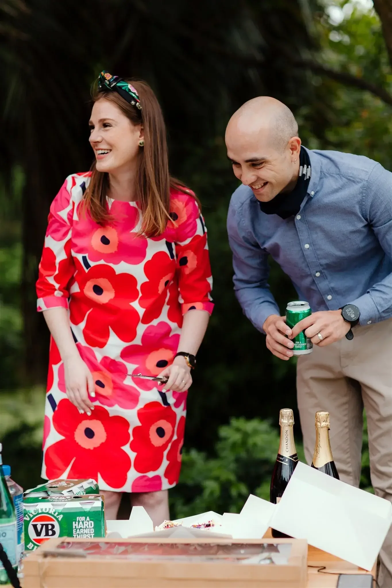 Couple having a BBQ in their backyard with friends after eloping at home with I Do Drive Thru — backyard wedding celebrant from $400