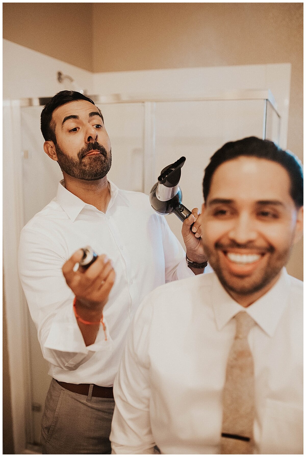 groom and friend getting ready