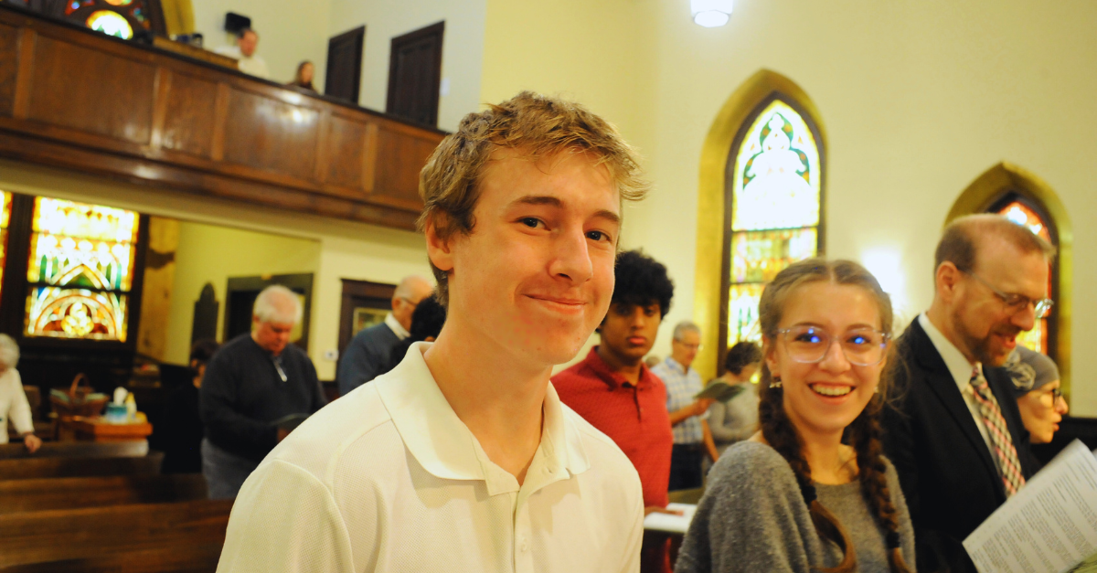 A father and two teens worship at Bethany Lutheran’s Sunday service.
