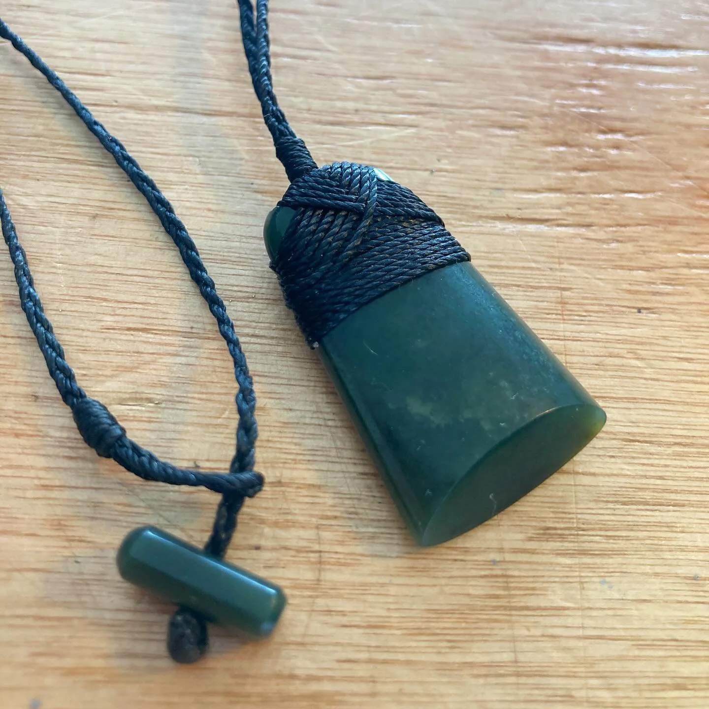 A fix we did recently for a customer of his NZ Paunamu toki necklace.
It was well loved and the cord work had almost fused together before becoming frayed.
Careful removal of the cord and a quick clean up of the stone meant we could restring this to 