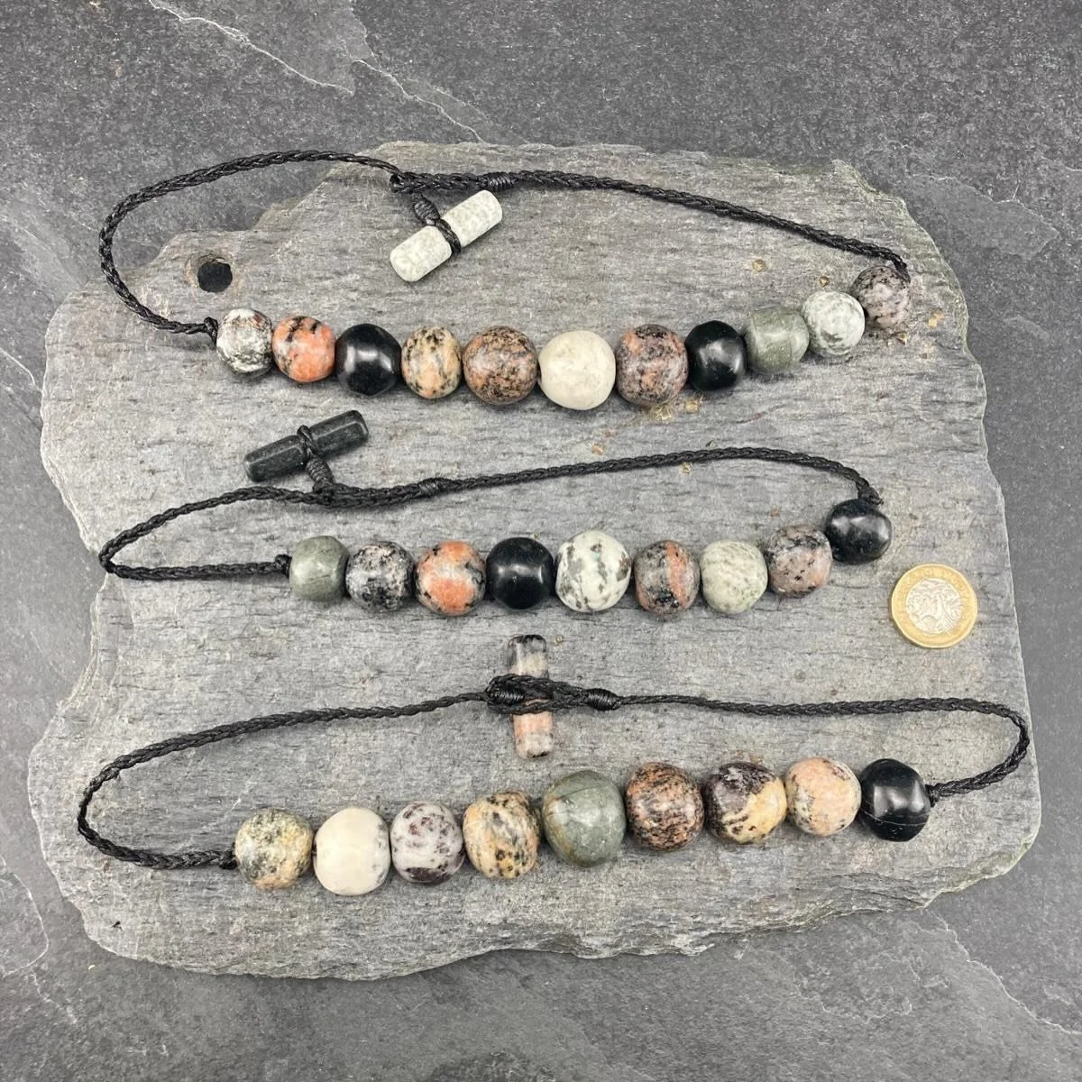 Each bead is cut, shaped, drilled and polished by hand before braided cords and hand carved toggles are added to complete the string. 

Isn&rsquo;t Harris amazing! 

#gneiss #rock #stone #beads #scotland heritage jewellery westernisles isleoflewis sk
