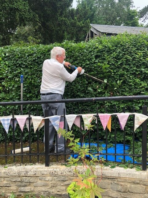Courtyard - Geoff trims the hedge, ready for visitors.jpg
