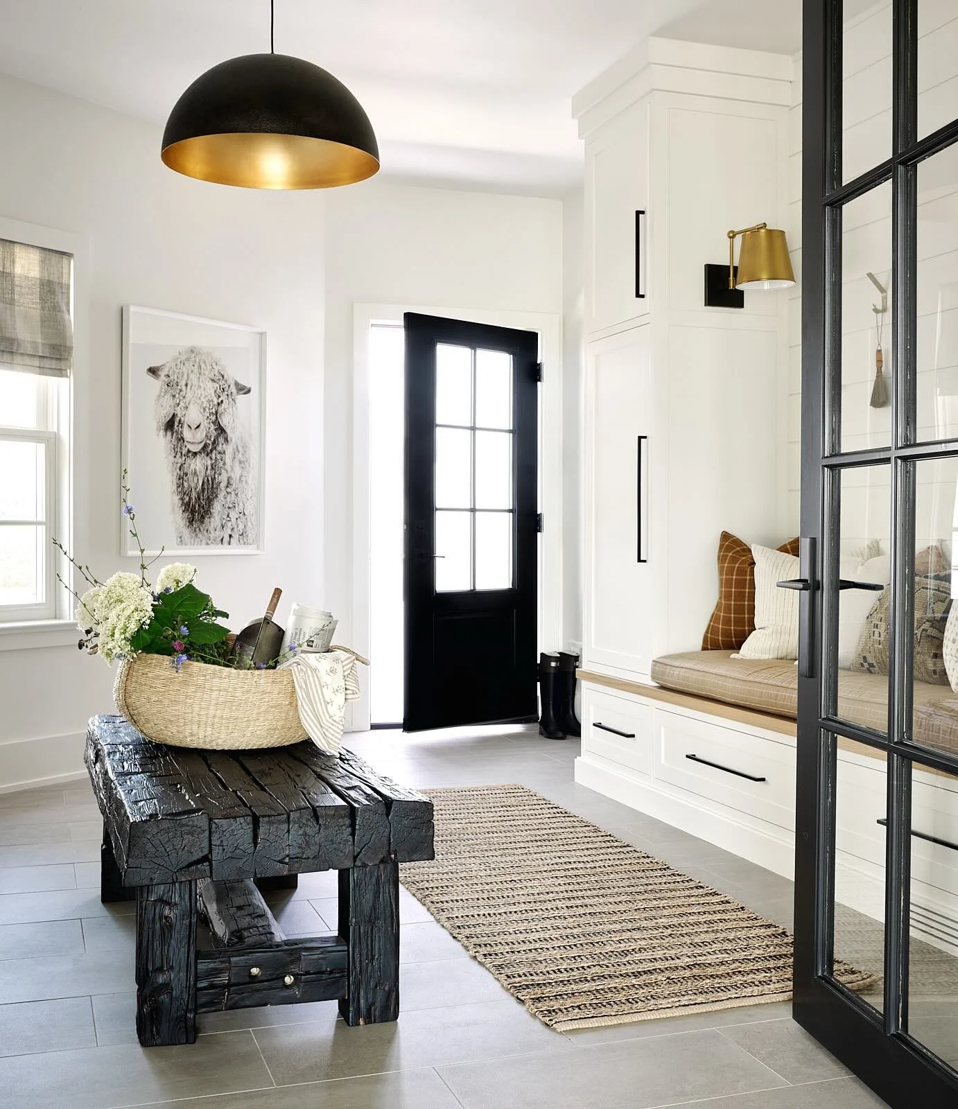 Throw back to Project School House Rock and this spacious entryway that actually used to be part of their garage (swipe through to see). These clients actually really had no mudroom space at all, so giving them this great extra storage and spot to ta