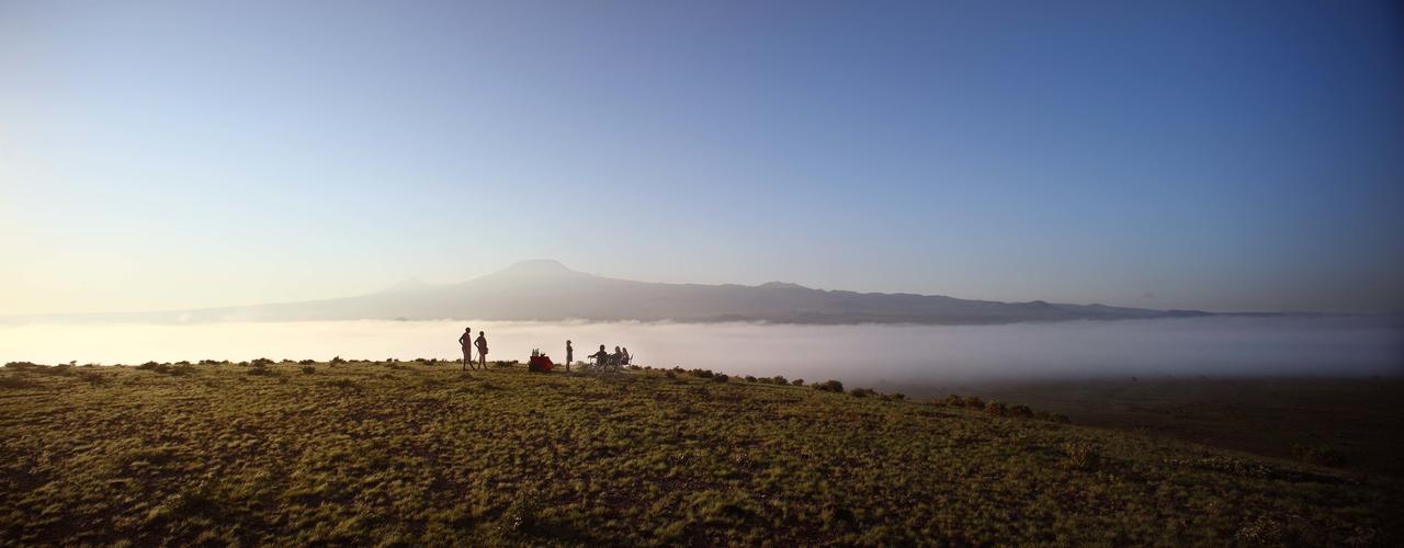 Tortilis Camp - Drinks in front of Kilimanjaro.jpg