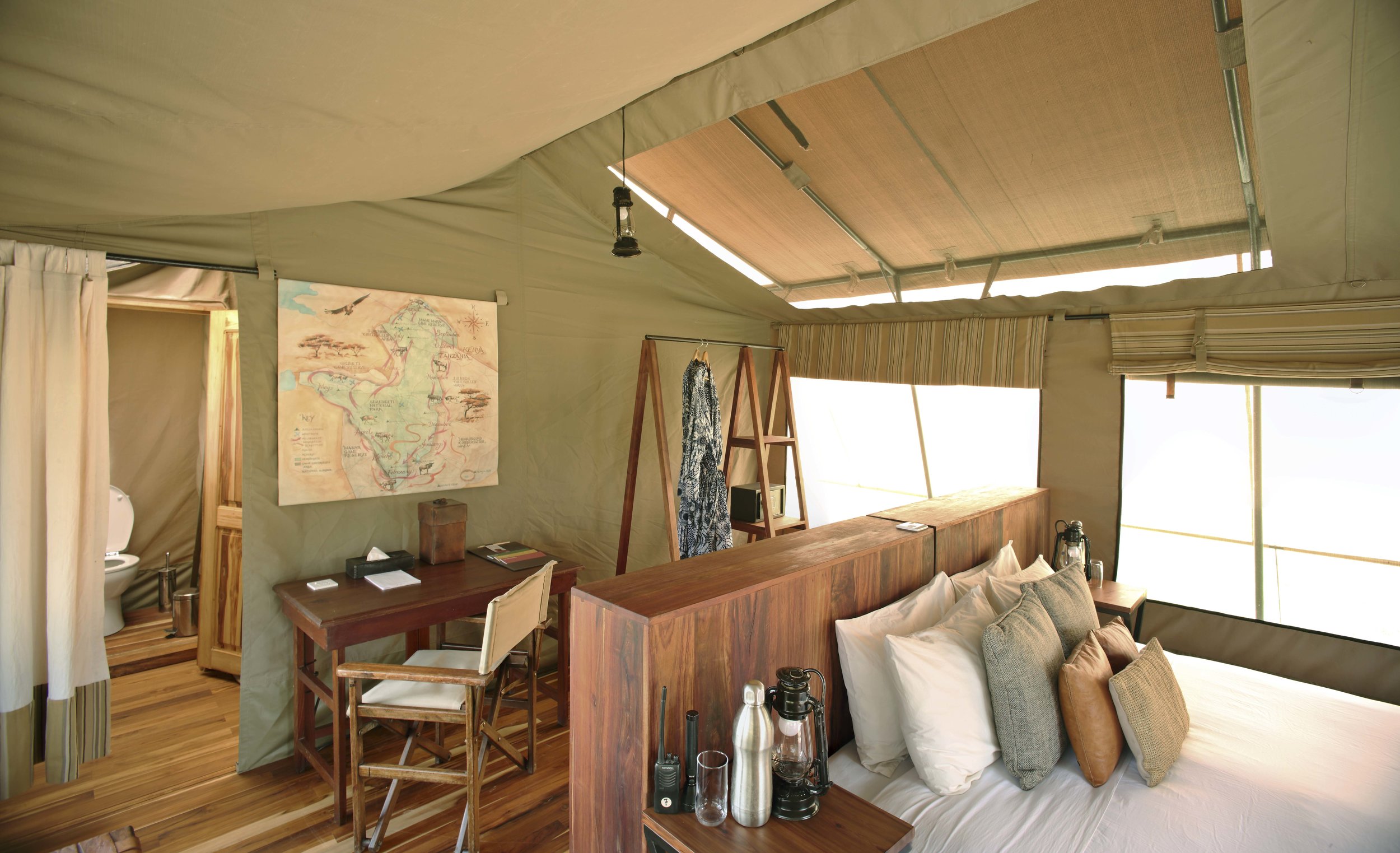 Olakira-En-suite-double-room-with-desk-area-and-clothes-rack-with-dressing-gowns-for-guest-use.jpg