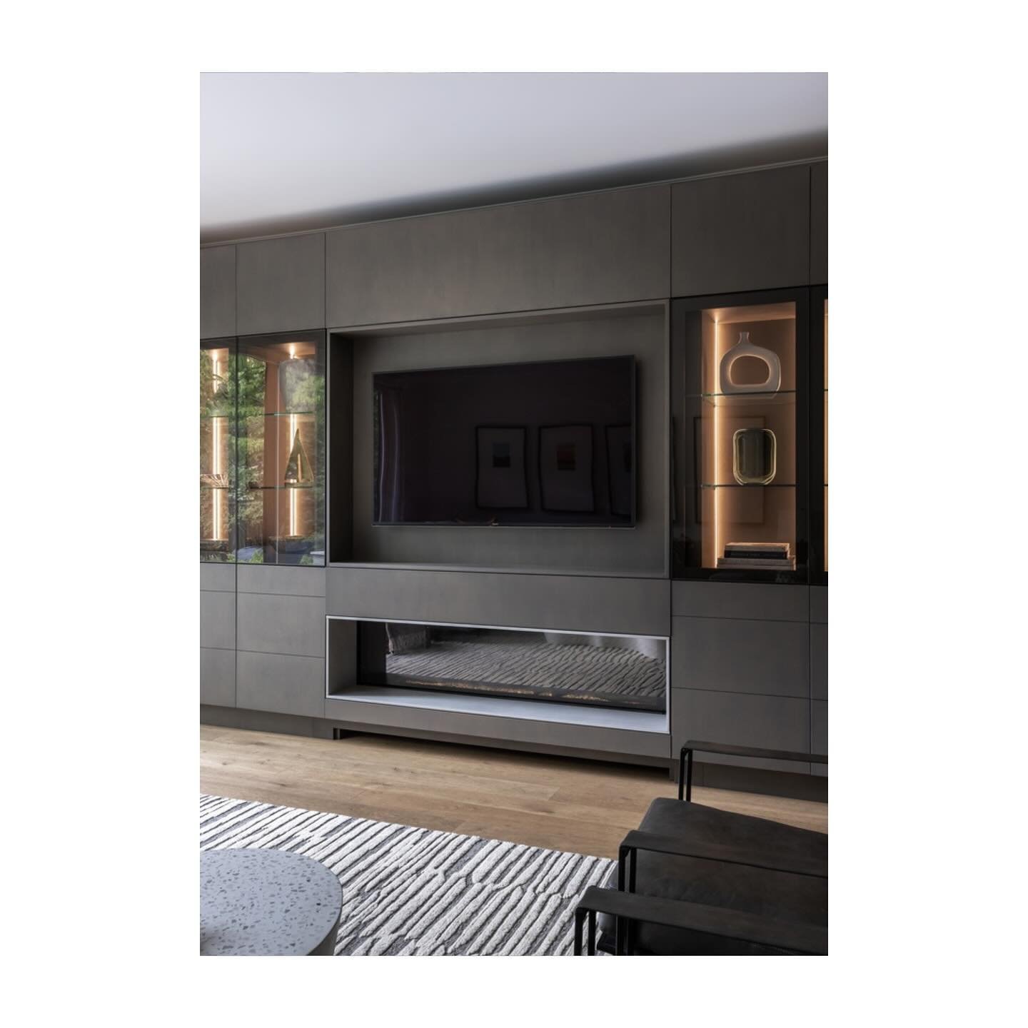 The effortless look of the new gas fireplace and built-in cabinetry belies the massive technical logistics that went into figuring out the tight placement of components, the venting, and the clearances. There wasn&rsquo;t a millimetre to spare.
 
Thi