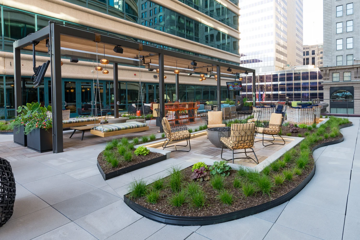 Fifth Street Towers, Minneapolis MN. Downtown work environments require amenity decks that complement hardscape and furnishings with vibrant floral and green interest. Our designers enjoy getting clients involved in the collaborative creative process.