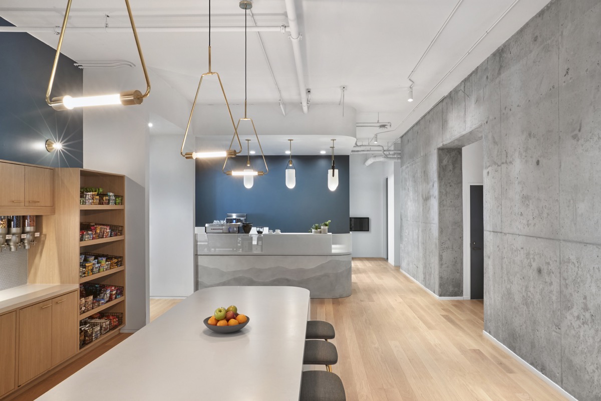Artistic plaster finishes bring interest to the office kitchen and coffee bar.