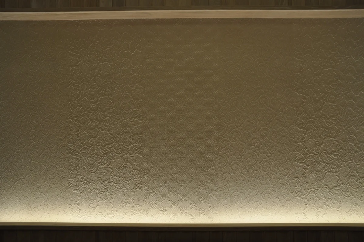 A close up of the art plaster panel.