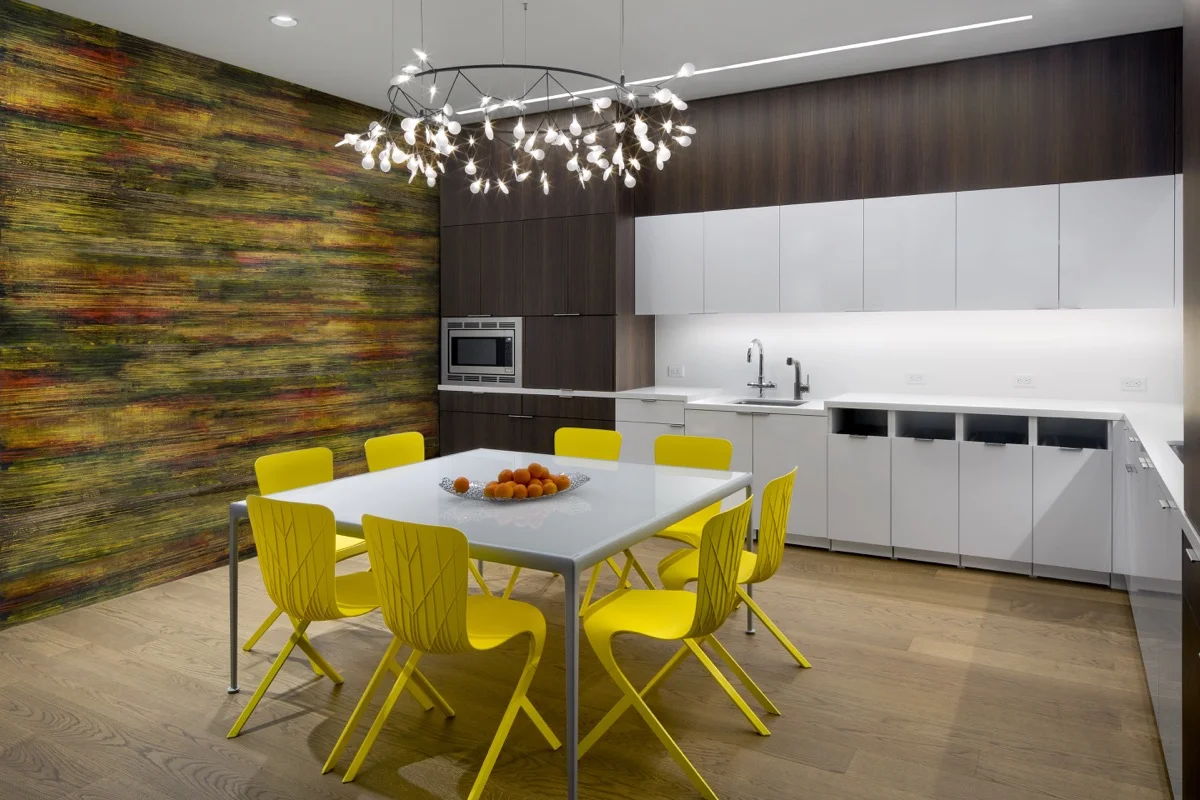 Level Five added a colorful, artistic wall to the office dining area.