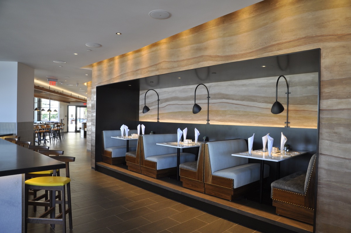 This artistic plaster finish in five colors mimics a rammed earth wall.