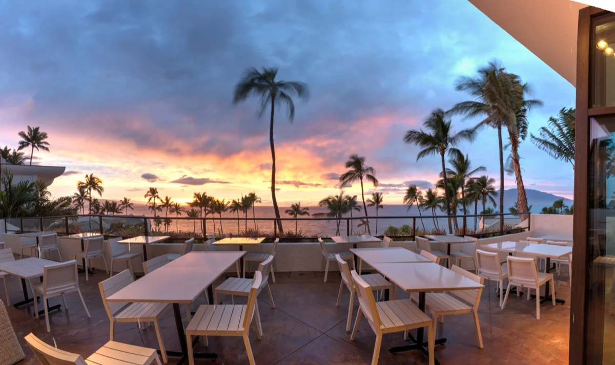 The restaurant sometimes overlooks a Maui sunset.