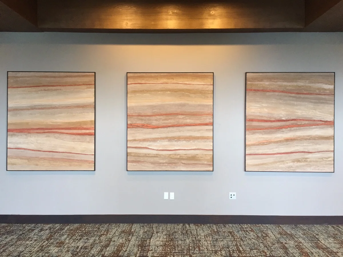 The geo-strata plaster finish is displayed in frames as fine art.
