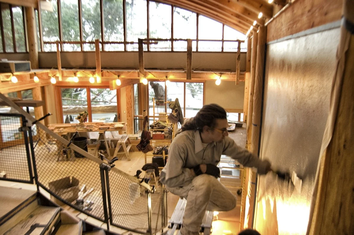 Level Five founder Rye Hudak applies the Japanese plaster finish.