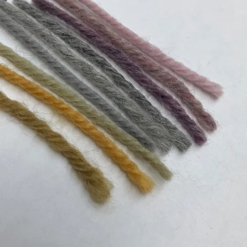 From left to right: UltraWool Kohlrabi, UltraAlpaca Dijon, Peridot, Nickel, Moonshadow, Light Grey, Sweet Nectar Mix, Candy Floss Mix, Tea Rose.