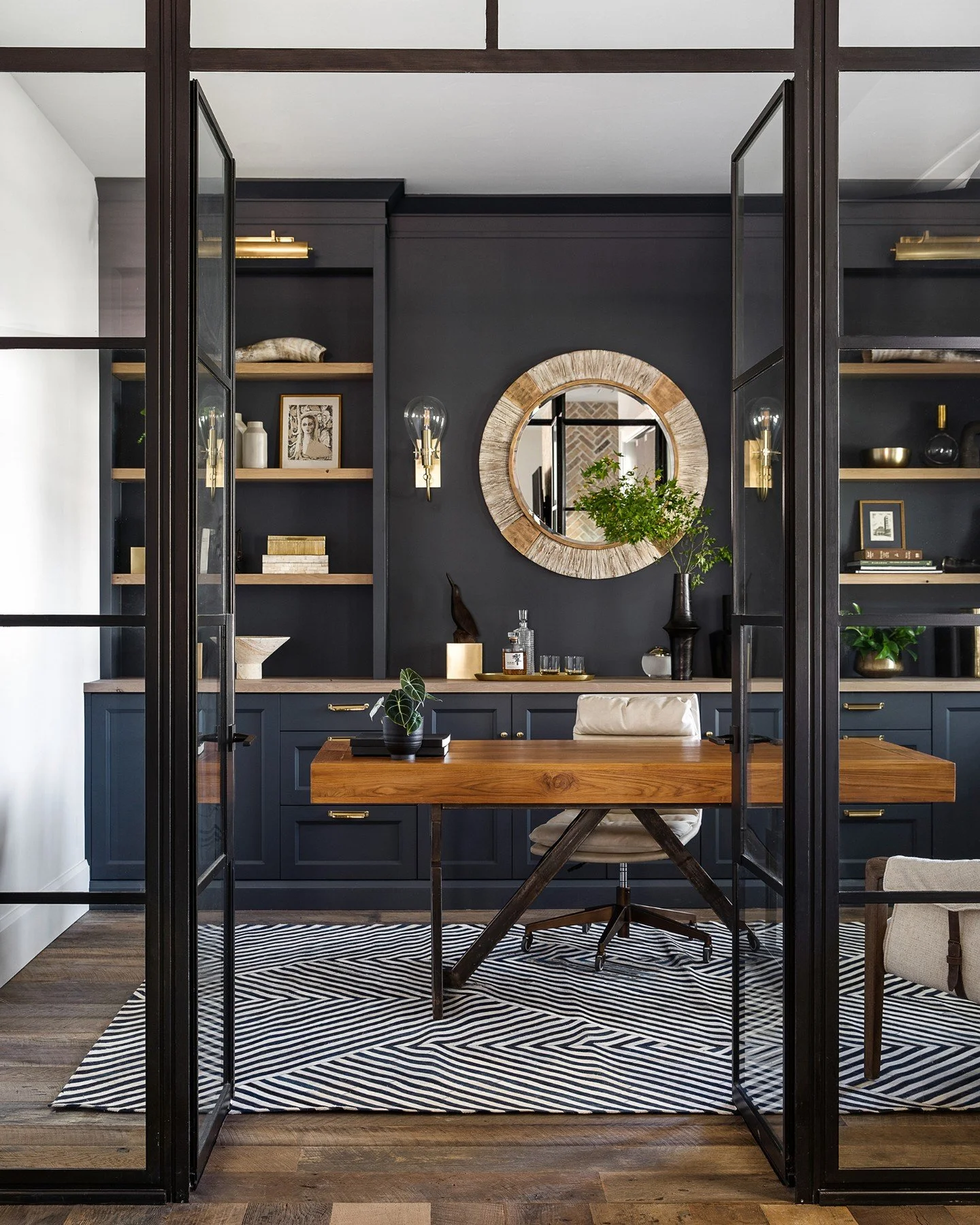 Refined, with an edge. At our #SycamoreProject, the office connects seamlessly with the home while maintaining its own sense of focus. Steel-framed doors, rich millwork, and symmetry create a workspace that feels composed and intentional. #caseyhowar