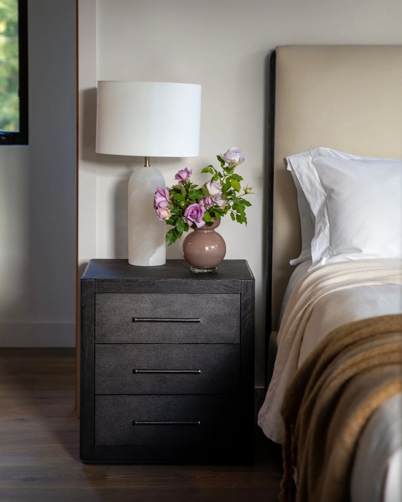 Our Lakeview primary suite embraces its mountain surroundings while introducing subtle touches of industrial character. Framed by expansive views, the landscape beyond becomes the room's most beautiful artwork, creating a space that feels both ground
