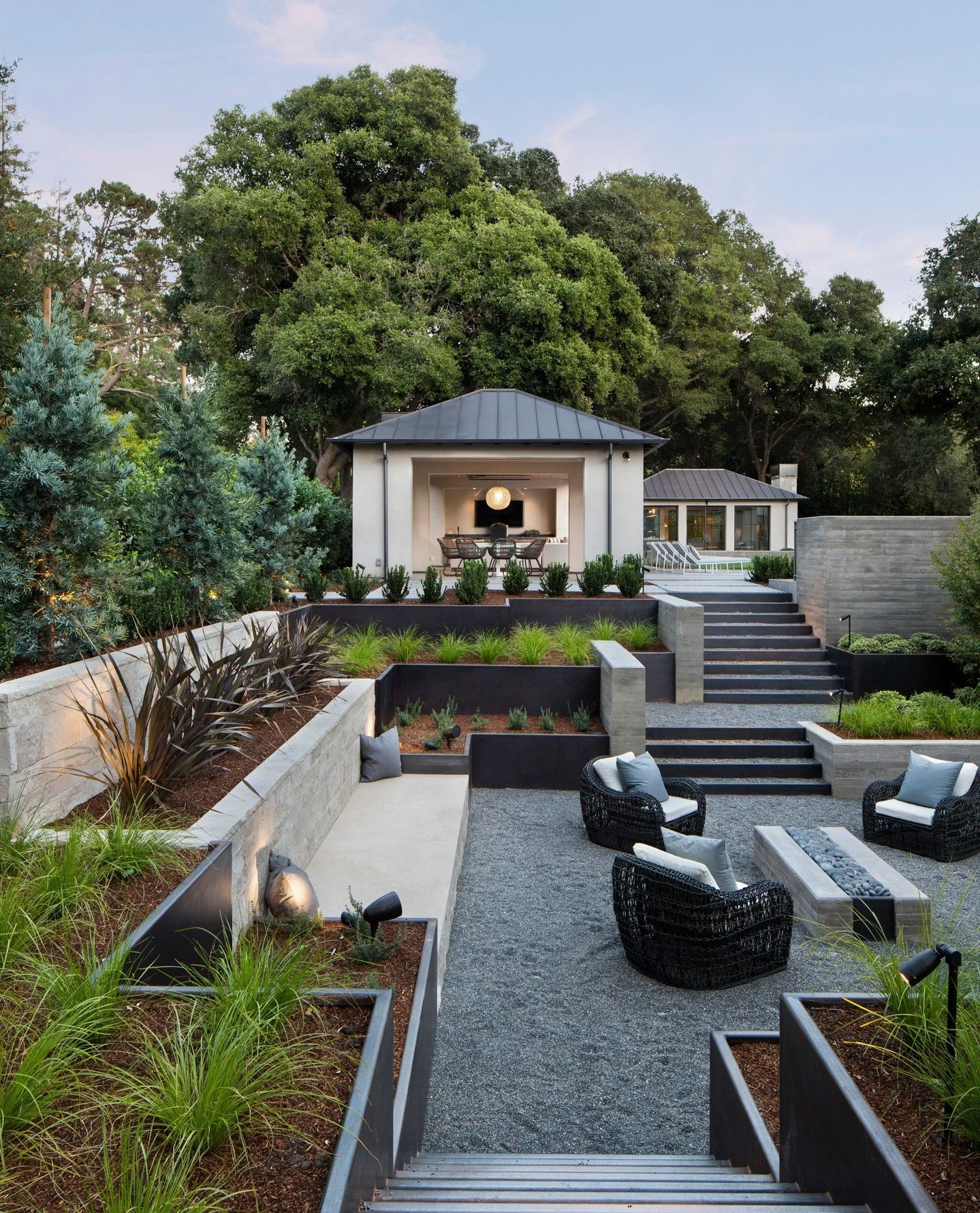 Great design extends beyond the walls of a home to embrace the surrounding landscape as part of the living experience.
Every change in elevation, planting bed, pathway, and gathering space influences how a property is experienced. When landscape and 