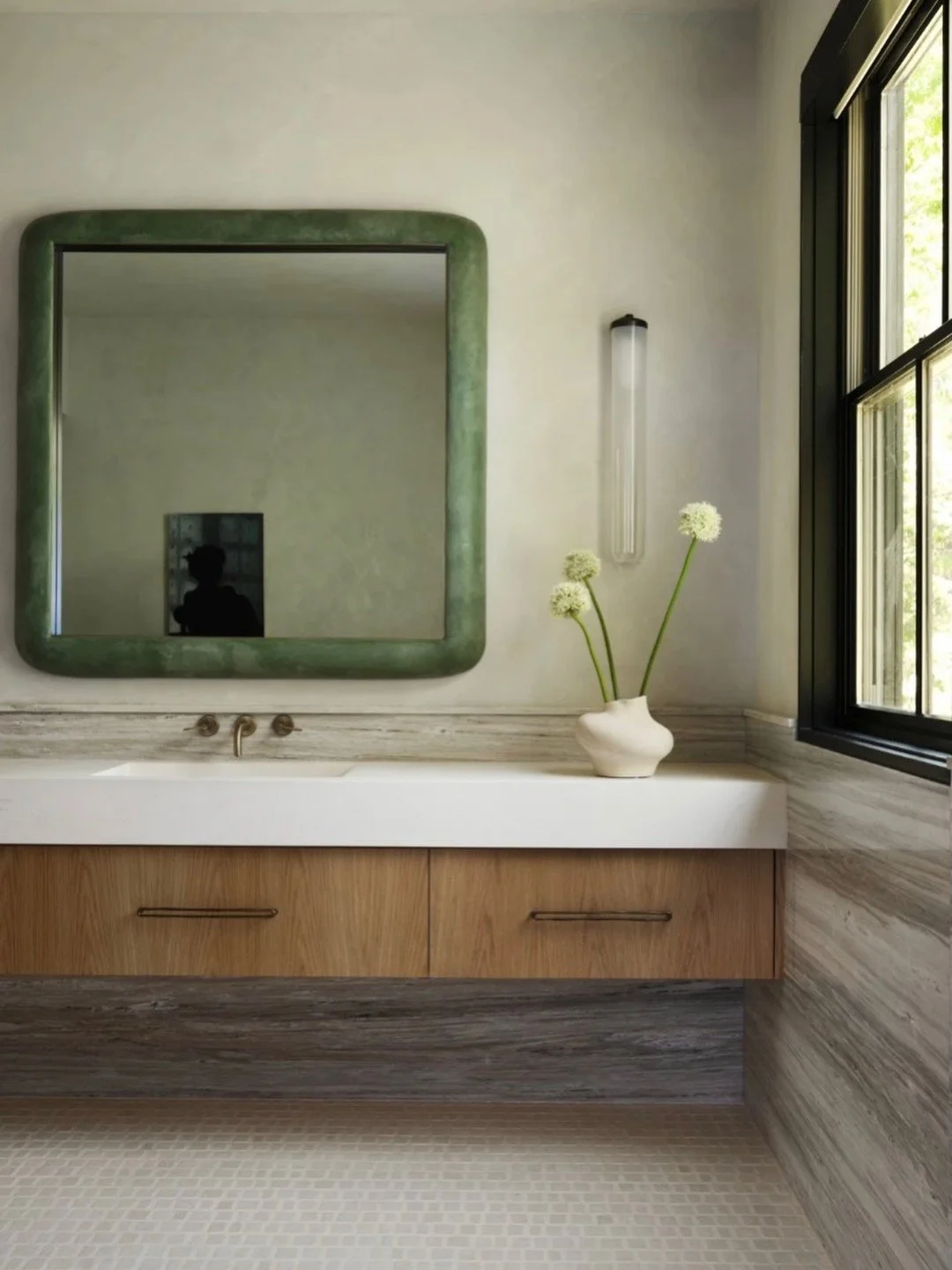 Natural materials have a way of creating quiet warmth and effortless sophistication. Layered travertine, plaster, warm wood, and soft green accents come together in a palette that feels refined, grounded, and beautifully understated. #inspo #original