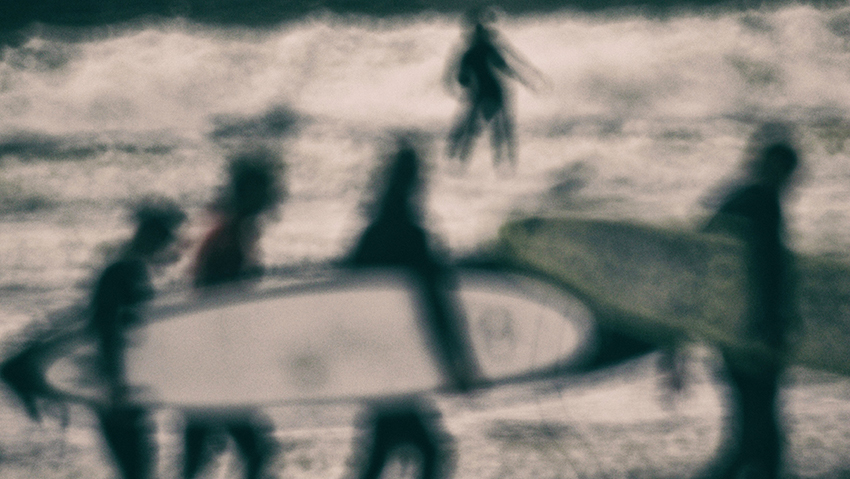 beach surfers walking.jpg