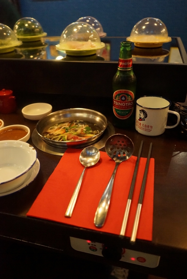 The raw ingredients are circulated conveyor belt style - choose what you want and drop into your broth