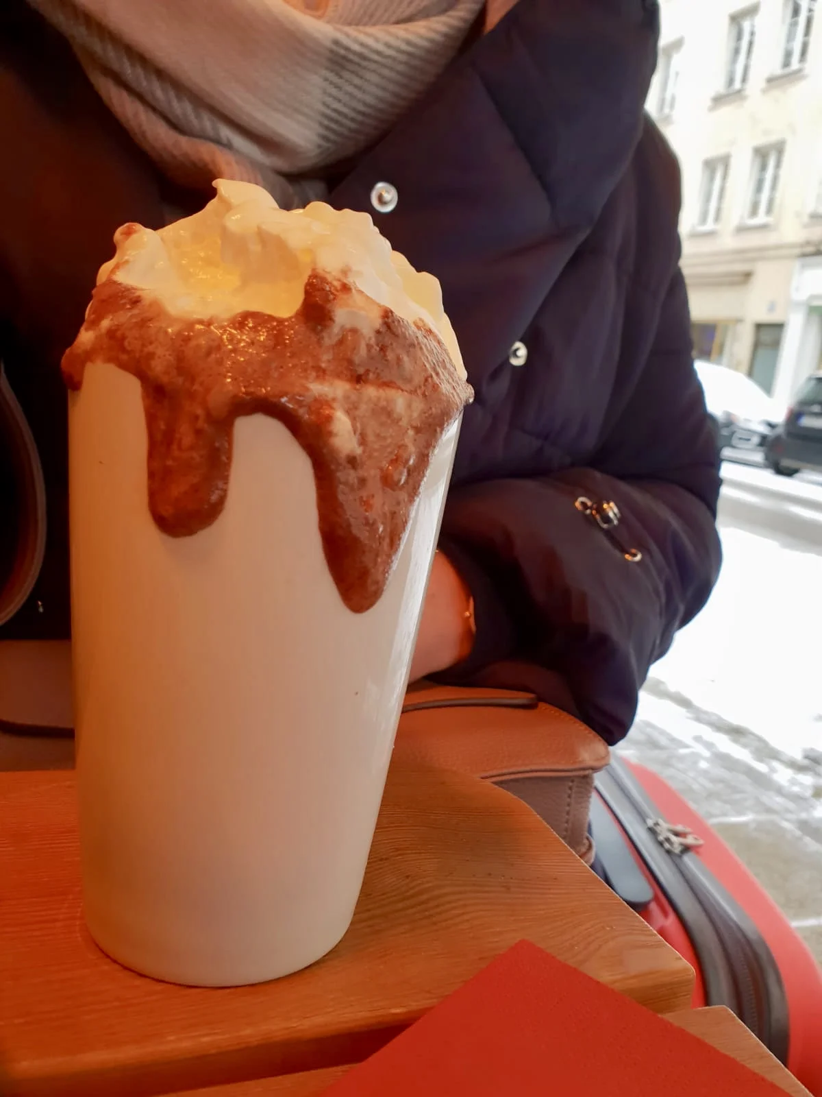 Hot chocolate with rum and fresh cream. Anything to help keep the chill at bay. Check out the snow in the background.