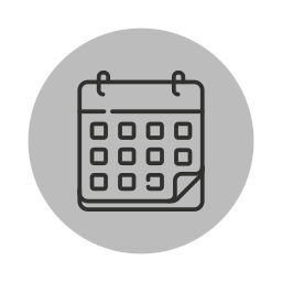 Icon of a calendar with a grid of days and two rings at the top
