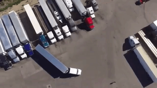 chill-man-explains-how-he-backed-his-semi-trailer-truck-into-a-tight-spot-in-satisfying-aerial-video.gif
