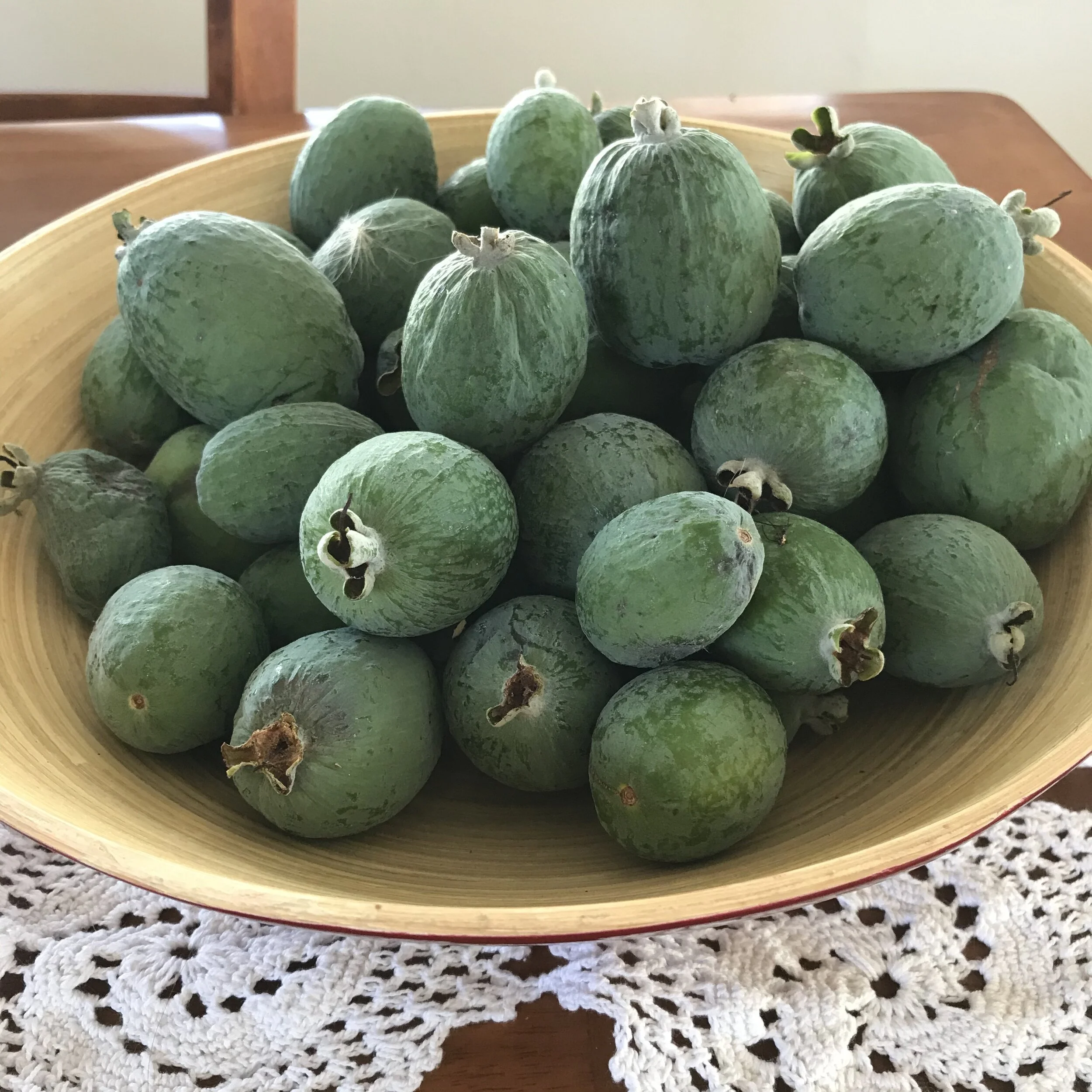 Feijoas in the fruit bowl perfuming the whole kitchen