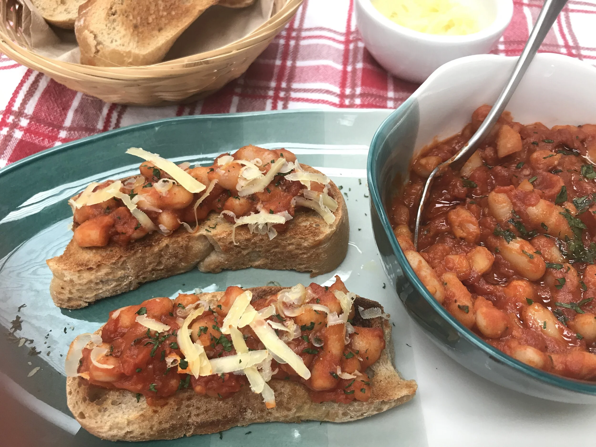 Homemade Baked Beans on crusty bread and topped with grated cheese