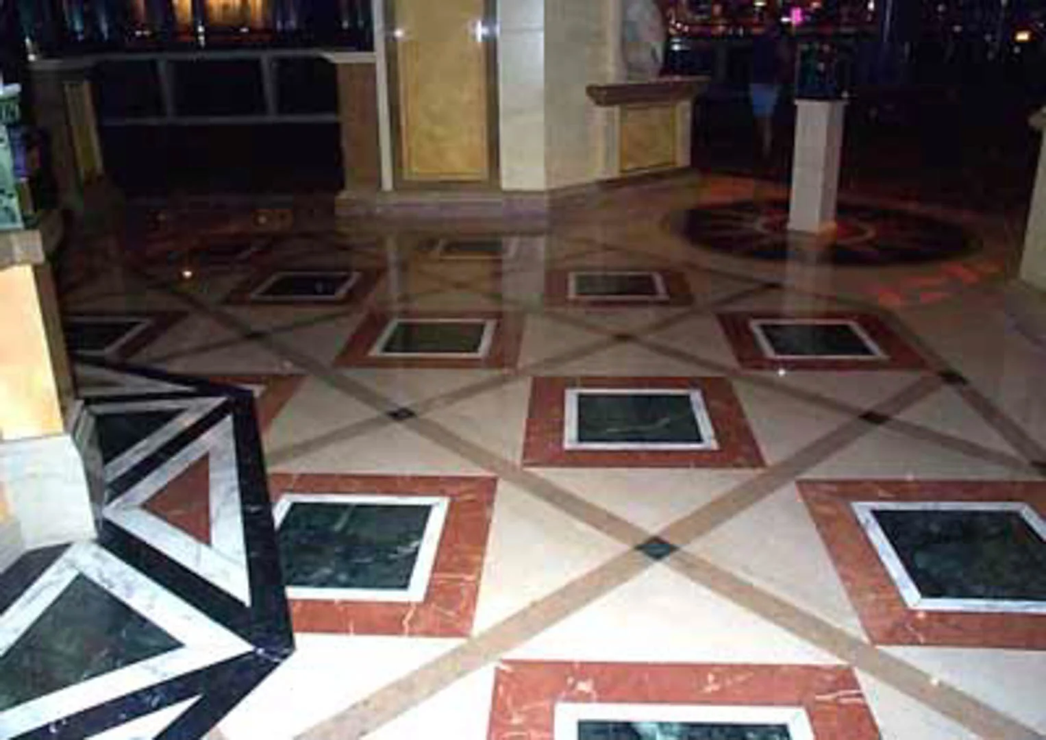 Project: Caesars Palace Hotel Location: Las Vegas, Nevada Description: Interior Paving The entrance to the Magical Empire is a good example of pattern designs in marble. These geometric shapes were cut from Spanish beige, Italian red and Taiwanese green marble.