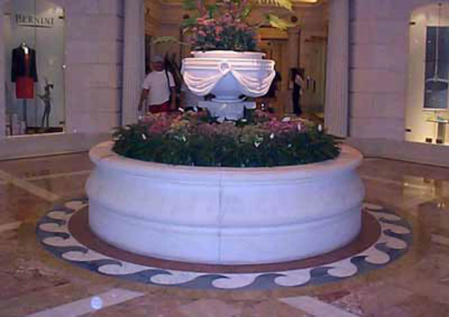 Project: Caesars Palace Hotel Location: Las Vegas, Nevada Description: Interior Paving Shown here is Italian marble paving surrounding a precast fountain and a waterjet wave design cut in white and blue marble.