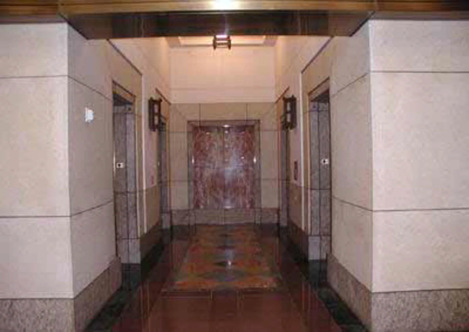 Project: Metropolitan Transit Authority Complex (MTA Gateway Complex) Location: Los Angeles, California Description: An elevator lobby with Minnesota Northern Gray Buff (dolomitic) limestone veneer and patterned stone paving is accented with a perfectly book matched Rojo Alicante endwall.