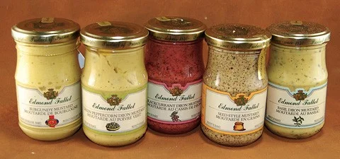 photo of five jars with liquid in it