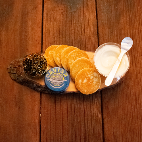 Basket with cheese wine and other goods