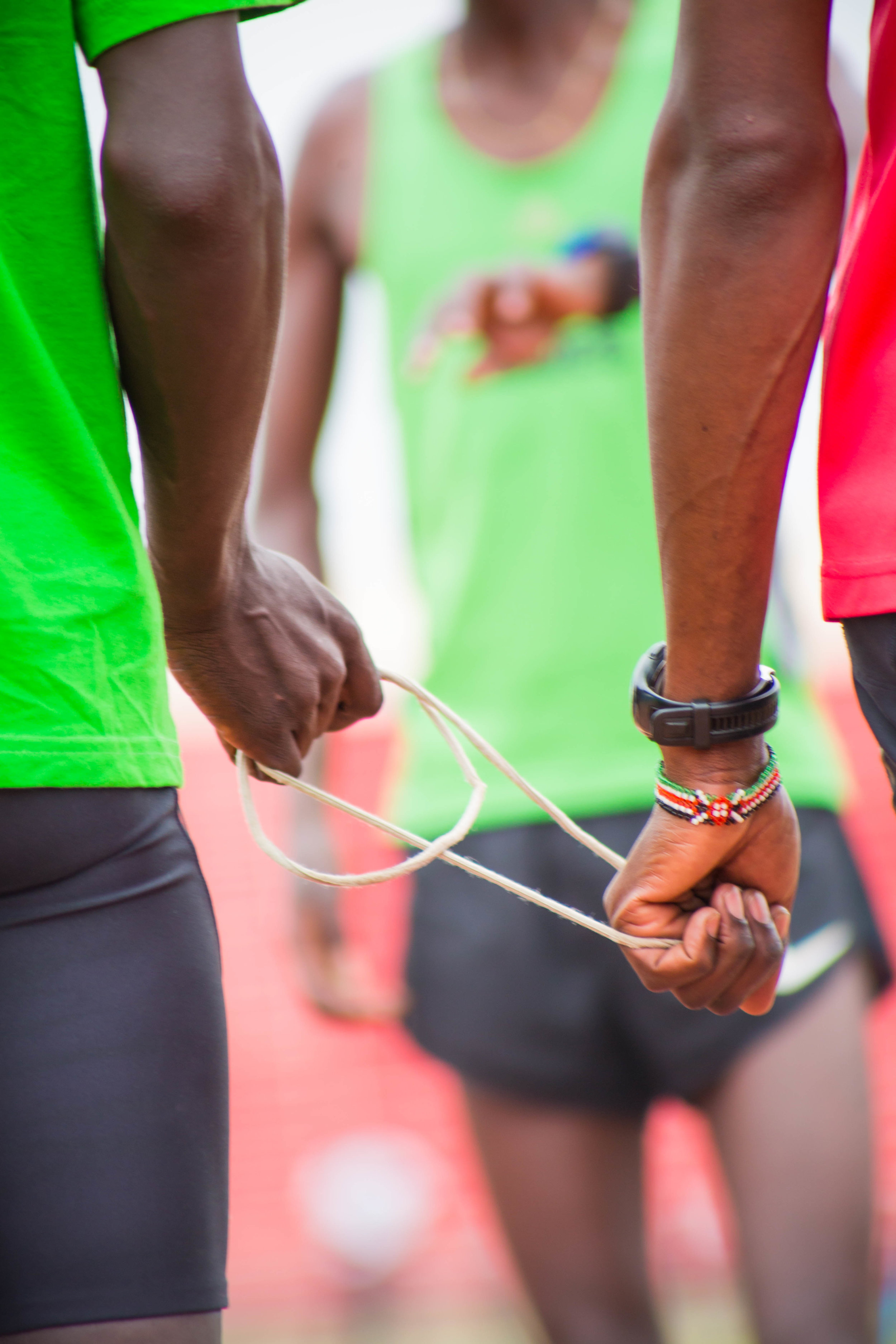  A guide and runner. Visually impaired athletes run with a guide. Athletes must rigorously train, memorizing their lanes. Stepping out of a lane results in disqualification. July 7 2017. Nairobi, Kenya. 