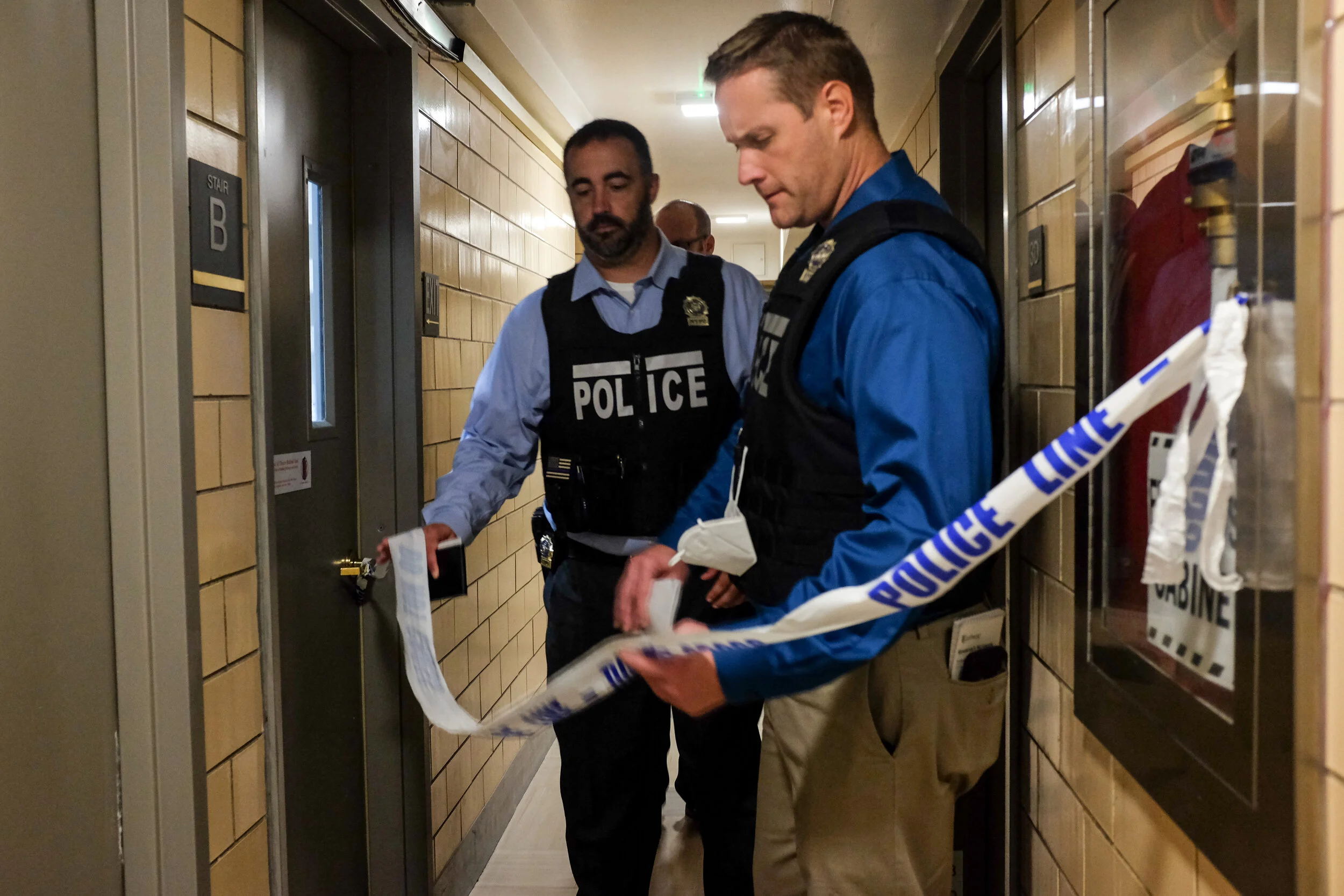 Detectives leave the crime scene after a seemingly normal church-going husband, Manuel Villar, 50, stabbed to death his 43-year-old wife Ivette inside their apartment on Beach 58th St. in the Rockaways in September. Ivette was remembered by resident