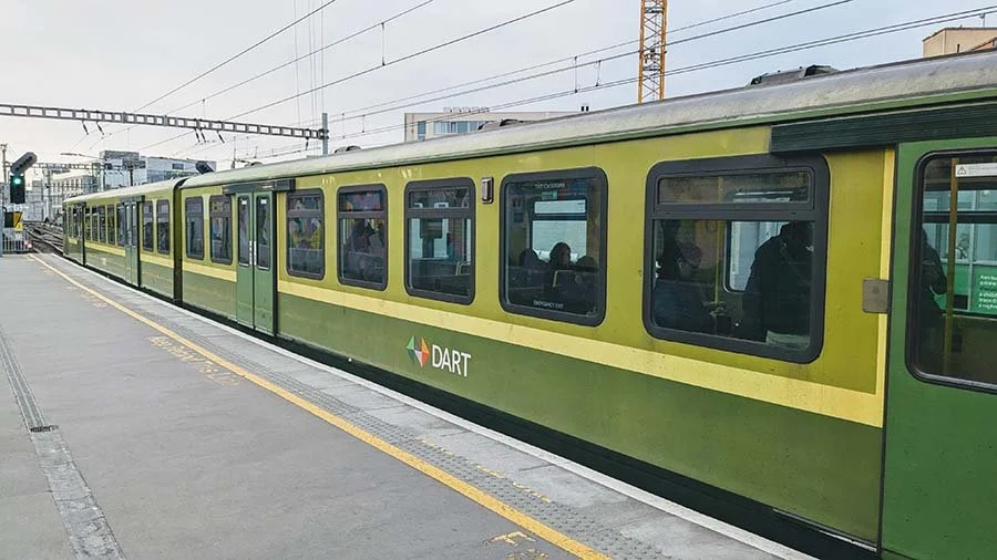 A Dart train at a platfrom.