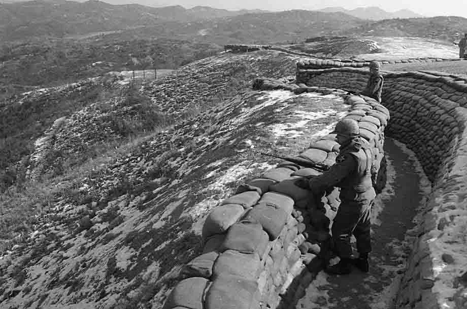 American soldiers keep watch for North Korean troop activity from a trench along the southern side of the DMZ, Feb. 8, 1968. (AP Photo)